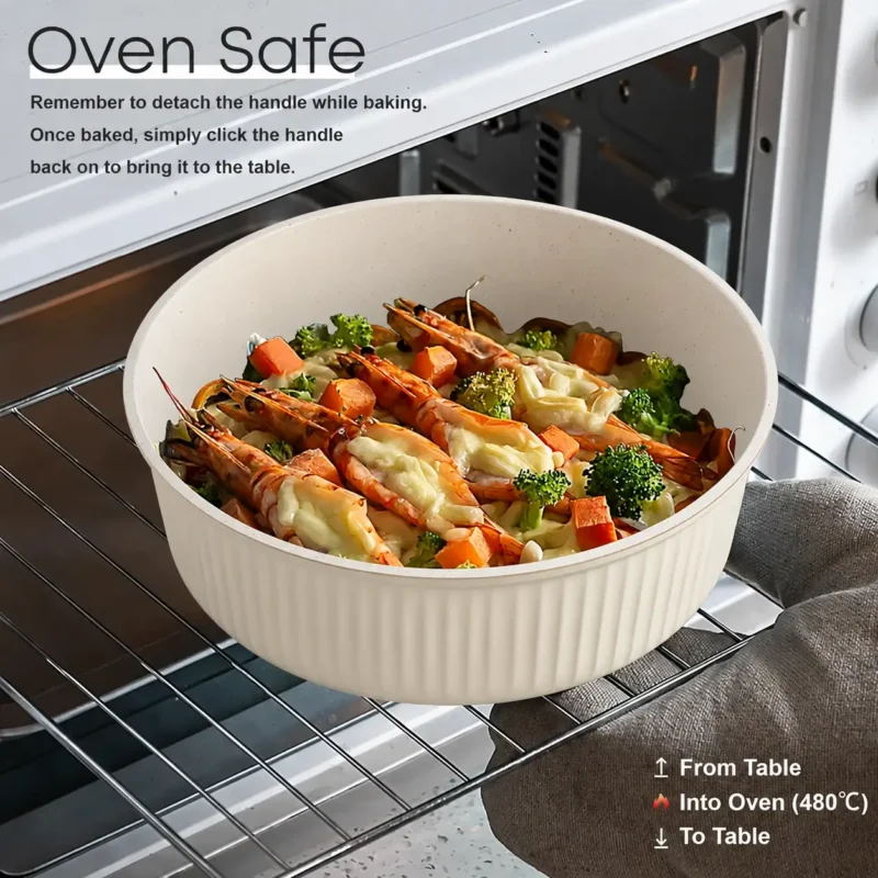 cream-cookware-pot-in-oven Cream ribbed cookware pot without its handle, holding shrimp and vegetables inside an oven.